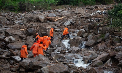 South Korean emergency workers conduct a search operation at the site of a landslide caused by heavy rains in Yecheon-gun, Gyeongsangbuk-do province, South Korea, 18 July 2023.