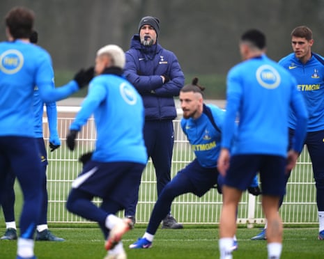 Igor Tudor (centre) looks on as his Tottenham players train.