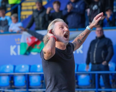 Robbie Savage gesticulates in delight after his new team’s victory