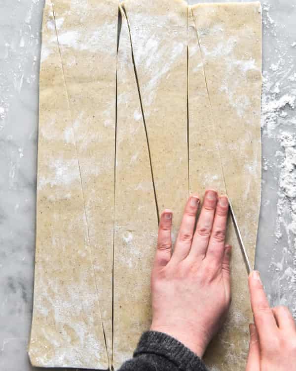 Dough being sliced into triangles