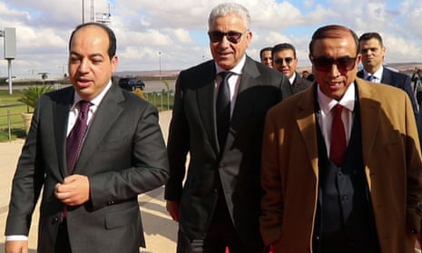 Presidential candidates Ahmed Maiteeq (left) and Fathi Bashagha (centre) arrive for a meeting with Libya's eastern military chief Khalifa Haftar, in the eastern city of Benghazi.