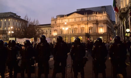 Police standing guard outside La Scala, Milan, 7 December 2015.