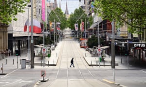 A pedestrian crosses Melbourne’s Burke Street Mall