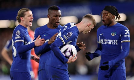 Chelsea players argue over who should take a second-half penalty against Everton