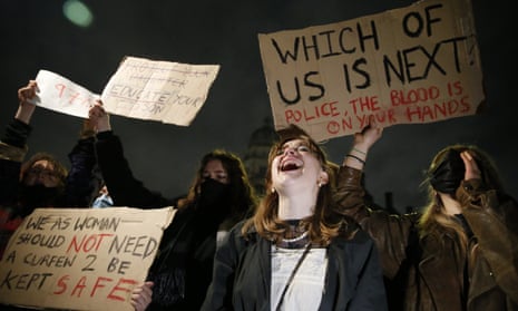 Protesters hold signs and shout during a protest criticising the actions of the police at last night’s vigil on Parliament Square on March 14, 2021 in London, England.