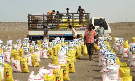 Displaced Yemenis receive food aid donated by a British organisation in Yemen’s western province of Hodeida on 9 February 2021.