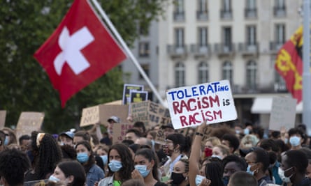 Protesters take part in a Black Lives Matter demonstration, in Geneva in July