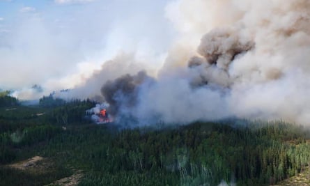 Smoke rises from the Paskwa fire as it burns near Fox Lake, Alberta, Canada.