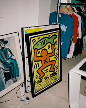 Colourful framed posters leaning against a wall