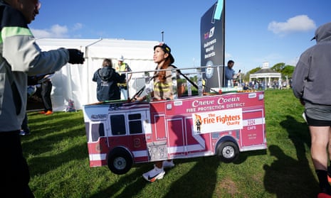 A competitor dressed as a fire engine in Blackheath before the London Marathon