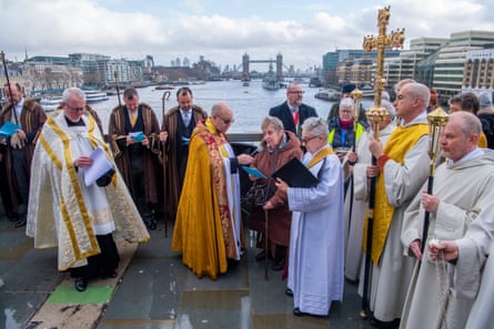 Clergy and congregations from St Magnus the Martyr and Southwark Cathedral meet in the middle of London Bridge for the annual Blessing of the River Thames service. Prayers are read for lost lives and people working on the river and a wooden cross is cast into the water.