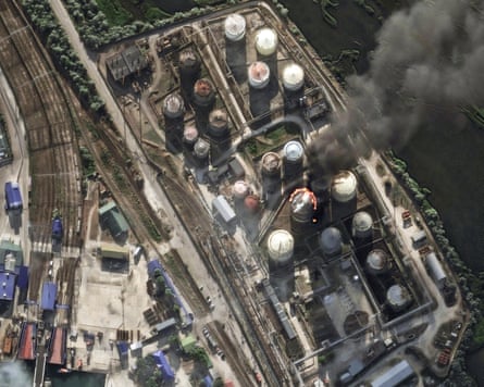 Satellite photo of an oil depot with one of its refineries on fire