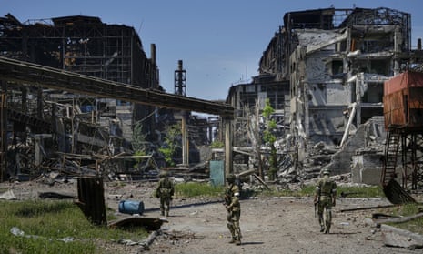 Russian soldiers patrol the Azovstal steelworks in occupied Mariupol