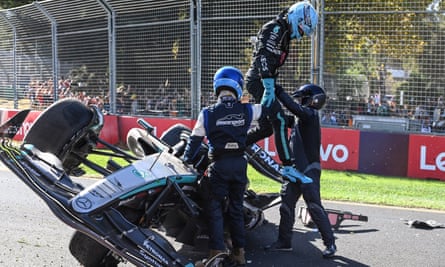 George Russell is helped out of his Mercedes after crashing at the Australian Grand Prix