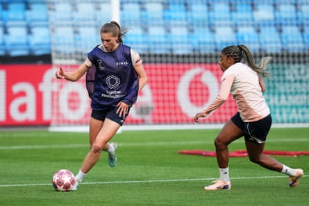 Lyonnes’ Jule Brand runs with the ball watched by Ashley Lawrence during a training session at Ullevaal Stadion.