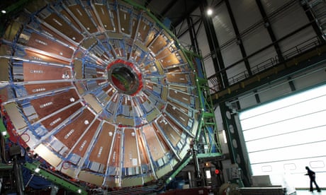Photo by Fabrice Coffrini. A woman walks near the world's largest superconducting solenoid magnet at the European Organisation for Nuclear Research (CERN)'s Large Hadron Collider.