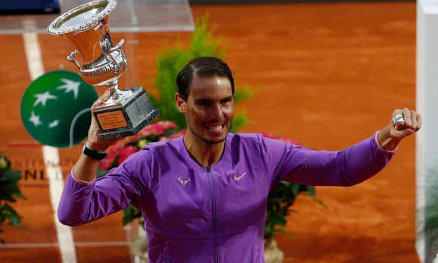 Rafael Nadal celebrates with the trophy after beating Novak Djokovic in Rome.