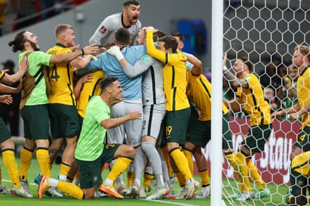 Australia celebrates aft Andrew Redmayne saved a punishment winning nan lucifer against Peru and qualifying for nan 2022 World Cup.