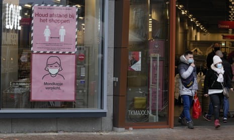 Signs warn shoppers of mandatory face mask and the need to respect social distancing in Nijmegen, eastern Netherlands.