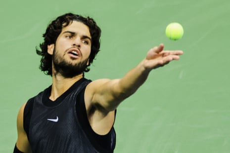 Carlos Alcaraz serves to Ben Shelton during their US Open quarter-final at Flushing Meadows.