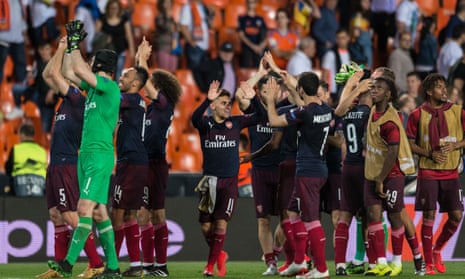 Arsenal celebrate with their fans after qualifying for the Euopa League final with a 4-2 win at Valencia. 