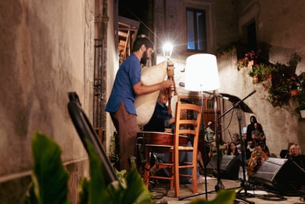 A musician playing the zampogna, an ancient form of bagpipes.