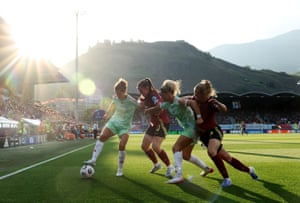 Cristiana Girelli and Emma Severini of Italy conflict for possession pinch Marie Detruyer and Sarah Wijnants of Belgium during their Group B lucifer astatine Stade de Tourbillon successful Sion