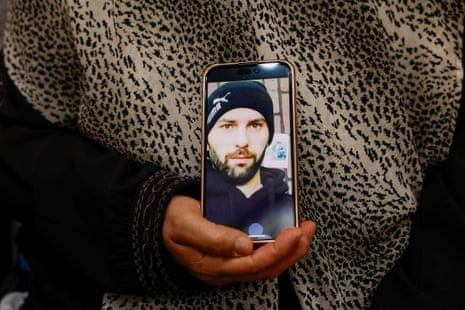 Haleema Ayyad holds her son’s photo after he died after an attack by Israeli settlers in the town of Silwad near Ramallah, in the Israeli-occupied West Bank.