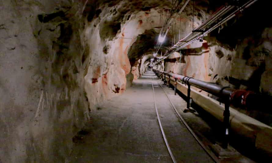 Overhead lights illuminate a tunnel inside the Red Hill underground fuel storage facility.