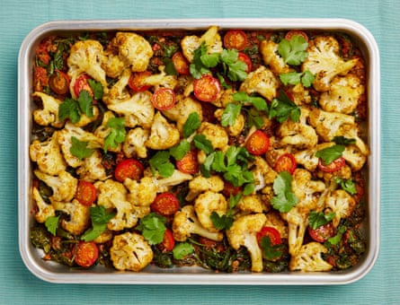 The vegan main: Yotam Ottolenghi’s baked cauliflower, with spices, spinach and tomato