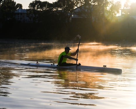 A canoeist paddles on Fitzroy River in Rockhampton, Queensland