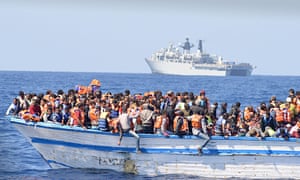 An overcrowded boat in waters north of Libya last year.