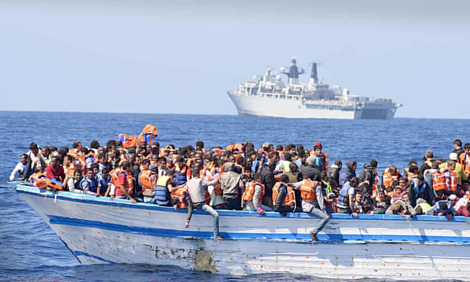 An overcrowded boat in waters north of Libya last year.