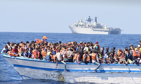 Refugees on an overcrowded  boat found in waters north of Libya