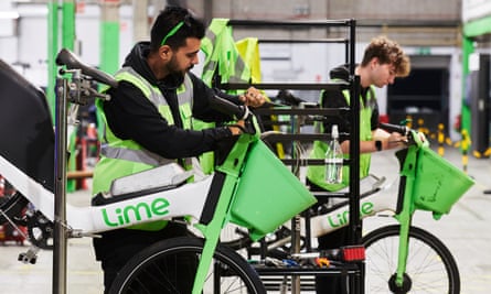 Lime technicians fixing the company’s bikes at its depot.