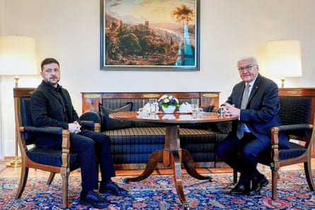 Volodymyr Zelenskyy with Frank-Walter Steinmeier sitting in front of a landscape picture at Bellevue Palace in Berlin
