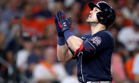 Adam Duvall of the Atlanta Braves celebrates after hitting a two run home run against the Houston Astros  in Game 1 of the World Series