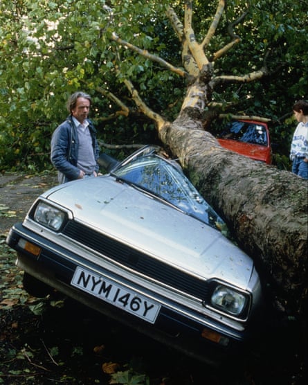 A car is crushed by a falling tree during the great storm of 1987.