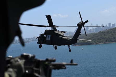 An Australian Defence Force’s new UH-60M Black Hawk helicopter flies over Sydney Harbour.