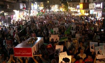 People protest against Ismail Haniyeh’s assassination and Israeli attacks on Gaza in Amman, Jordan