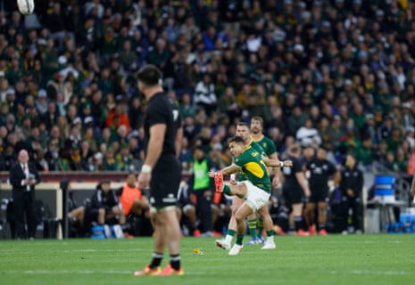 Springboks' Cheslin Kolbe sticks the ball between posts.