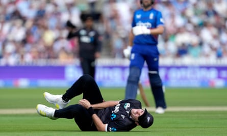 Tim Southee lies down with pain after fracturing a bone in his thumb