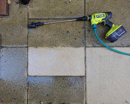 A patio slab after the Ryobi 18V One+ pressure washer has cleaned it