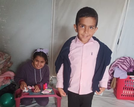 The children inside a tent