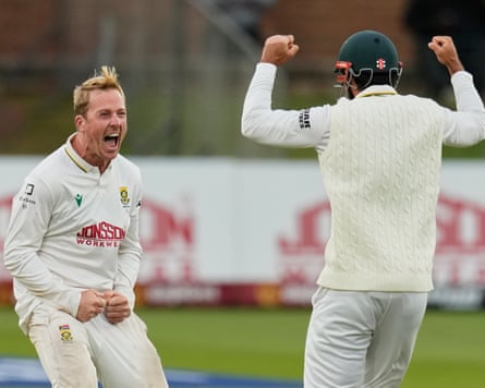 South Africa’s Simon Harmer (left) celebrates taking the wicket of Australia’s Beau Webster with a teammate.