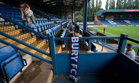 A volunteer cleaning up Gigg Lane in 2019