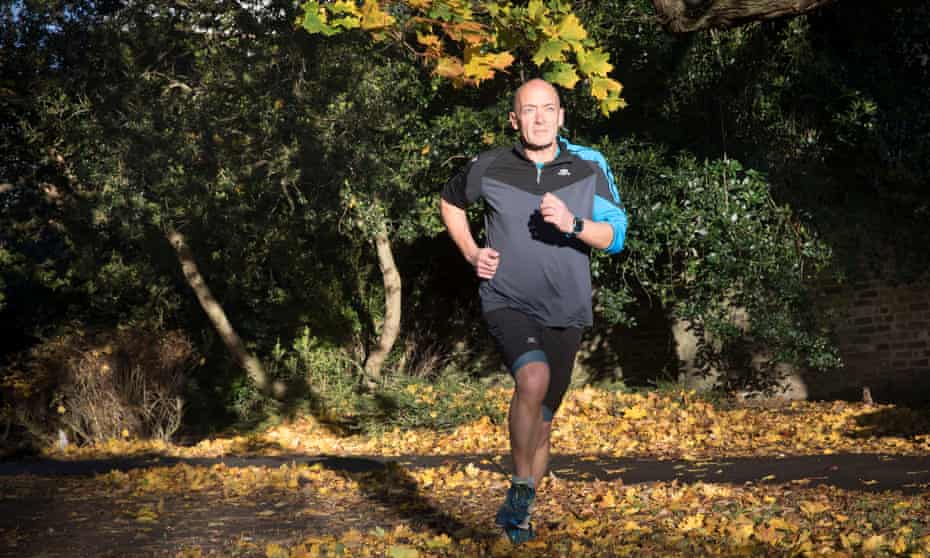 Phil Daoust running in a park in south London