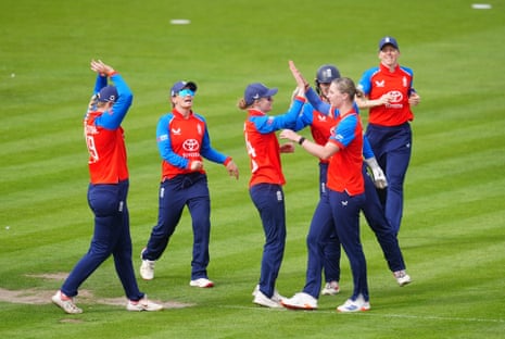 England's Freya Kemp celebrates taking the wicket of India's Jemimah Rodrigues with teammate Charlie Dean.