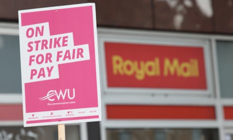 A sign held by a postal worker on the picket line at the Royal Mail Whitechapel delivery office in east London