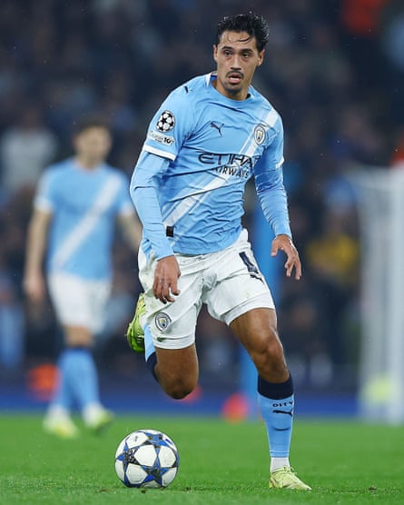 Tijjani Reijnders dribbles the ball during the Champions League match between Manchester City and Borussia Dortmund